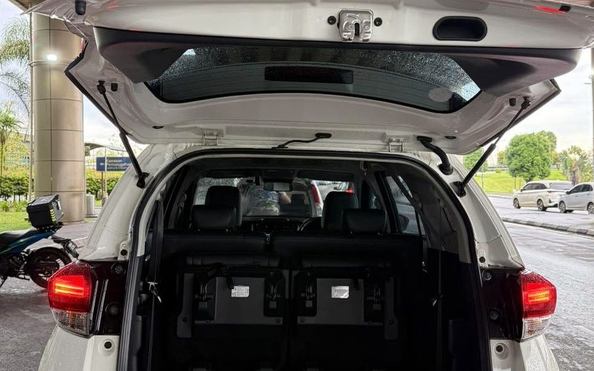 Boot of a Perodua Aruz with the tailgate open, third row upright