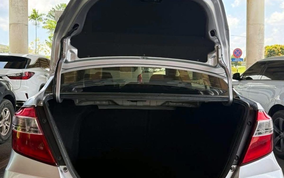 Open boot of a Perodua Bezza sedan showing its deep luggage space